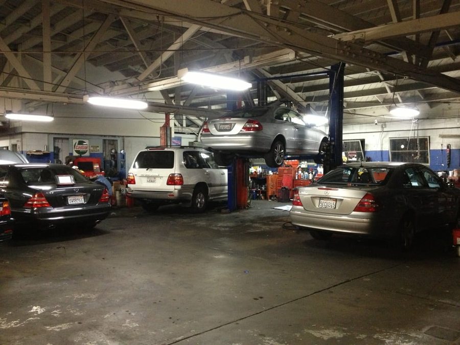 Every lift in the garage occupied, cars nose to tail across the bays